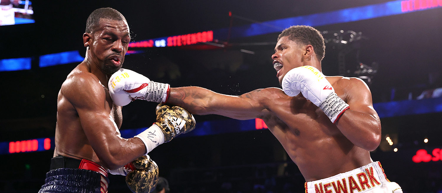 ATLANTA, GEORGIA - OCTOBER 23: Jamel Herring (L) and Shakur Stevenson (R) exchange punches during their fight for the WBO world junior lightweight championship fight at State Farm Arena on October 23, 2021 in Atlanta, Georgia.(Photo by Mikey Williams/Top Rank Inc via Getty Images)